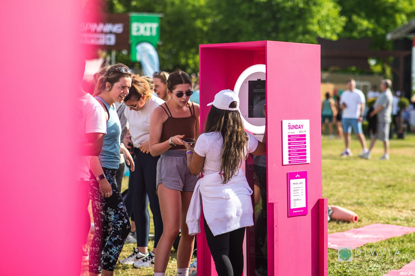 Photo booth finished in a custom pink vinyl wrap at an outdoor brand activation